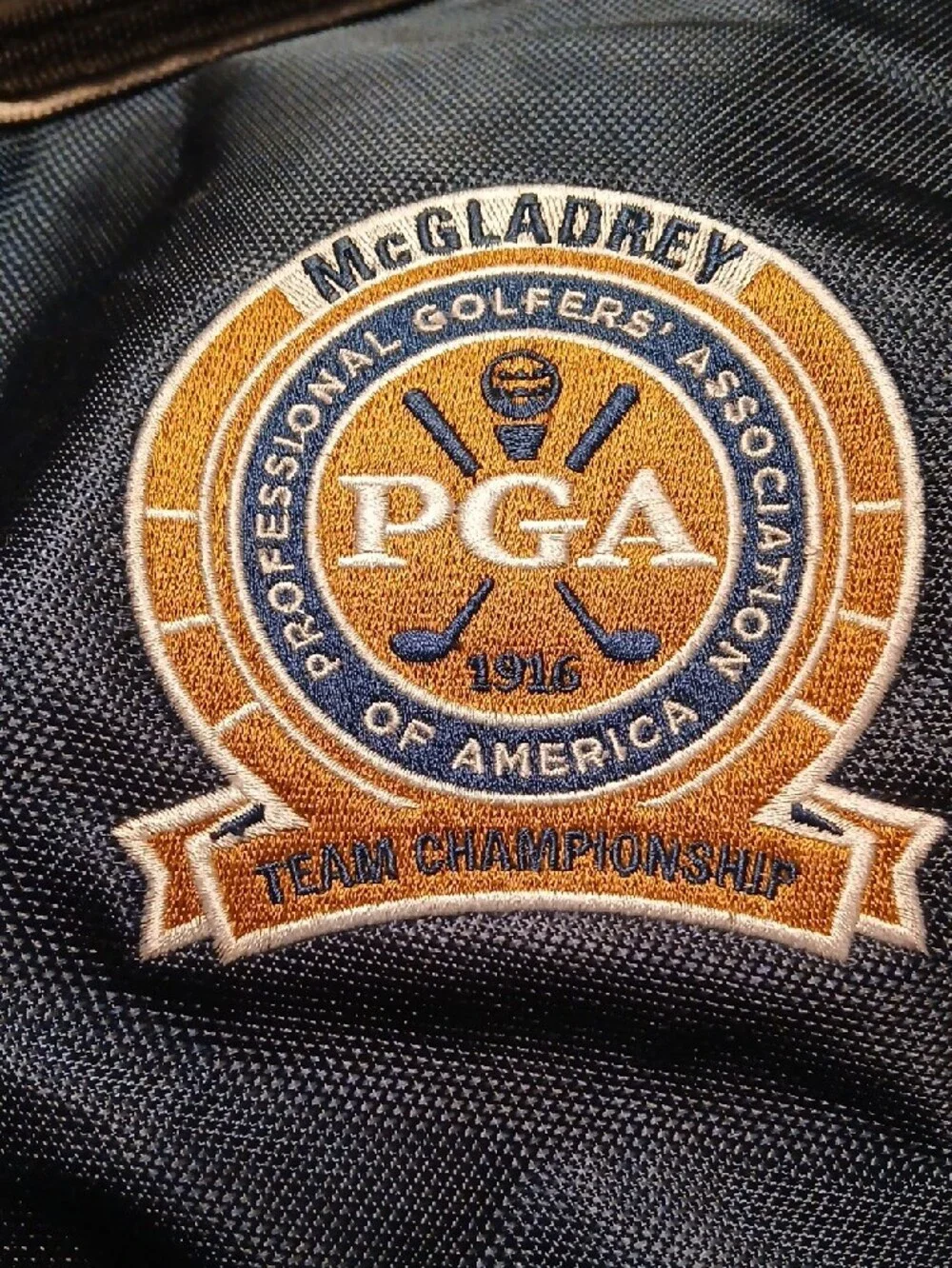 PGA Tour Black and Navy Blue Sling Backpack with PGA Logo